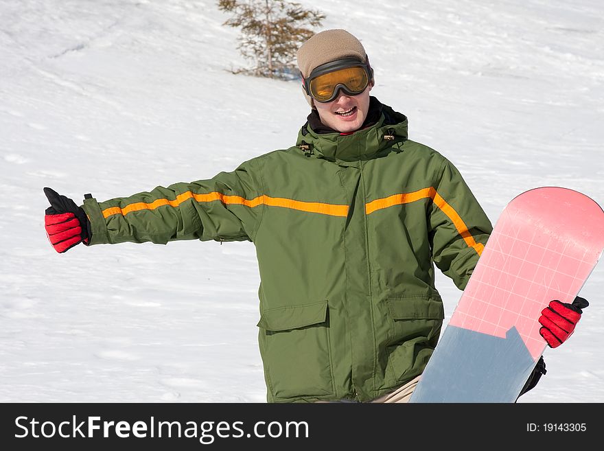 Young man with snowboard outdoors. Young man with snowboard outdoors