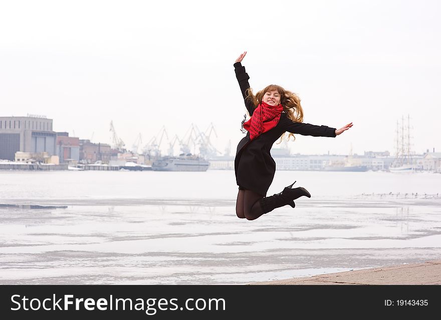 Happy young woman with long hair jumping. Happy young woman with long hair jumping