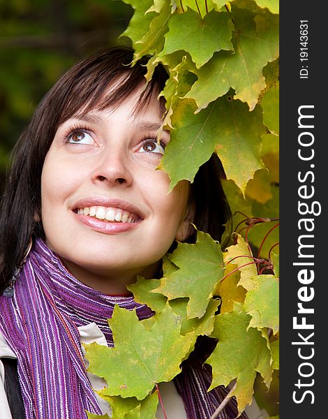 Young pretty woman smiling in fall forest. Young pretty woman smiling in fall forest