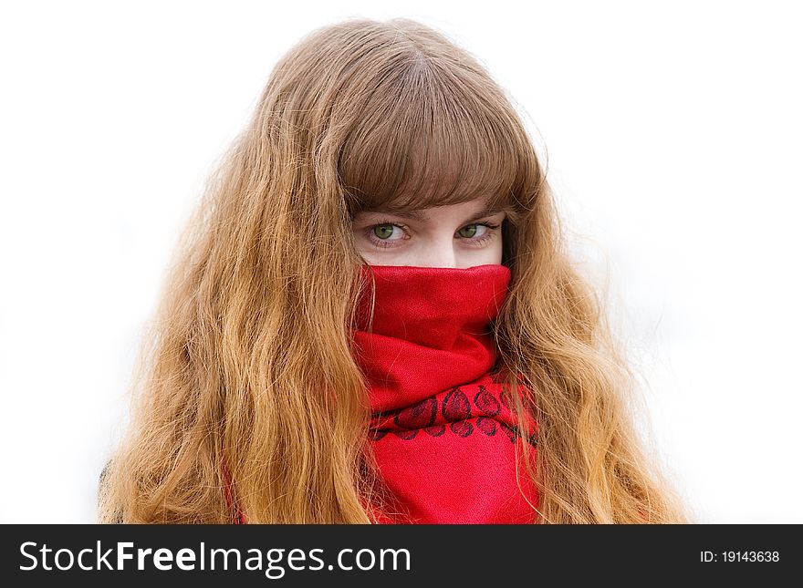 Beautiful girl with green eyes and long hair in the red scarf on the white background. Beautiful girl with green eyes and long hair in the red scarf on the white background