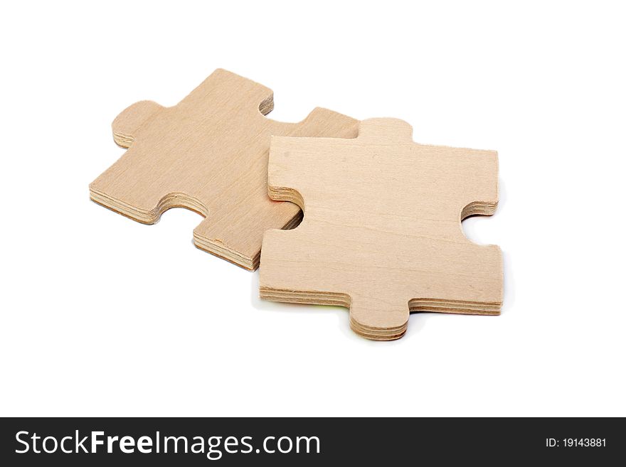 Wooden elements of a puzzle on a white background