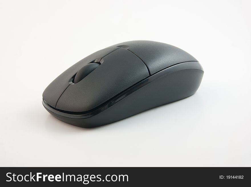 A generic, black wireless computer mouse. A generic, black wireless computer mouse.