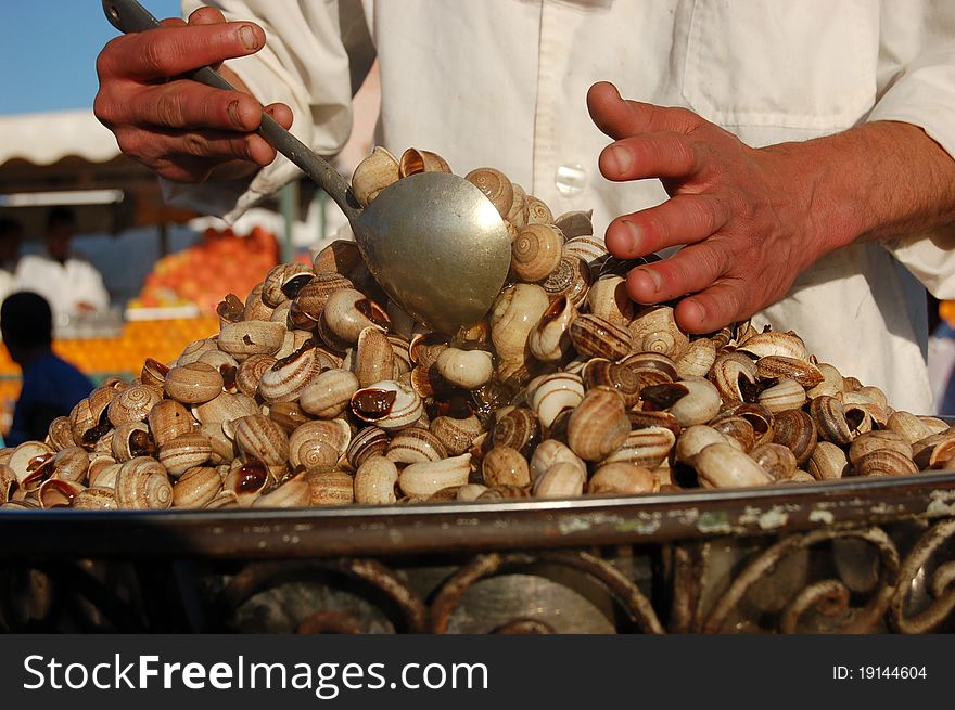 Cooking snails in the market in maroco