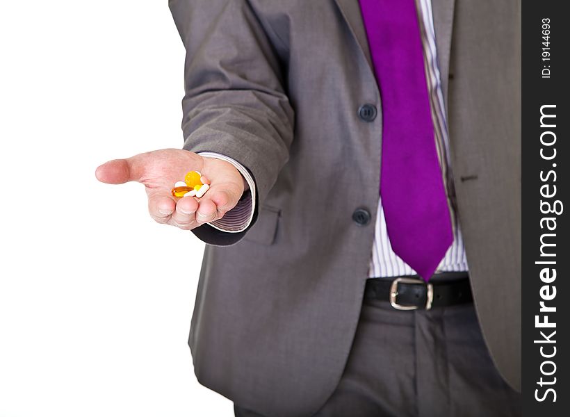 Man in suit holding pills isolated on white