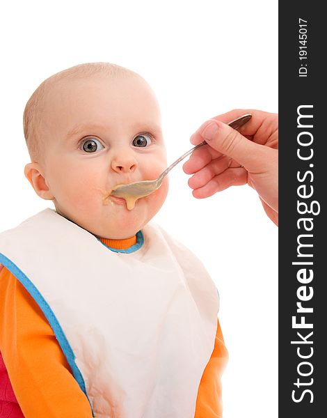 Kid eats on a white background. Kid eats on a white background.