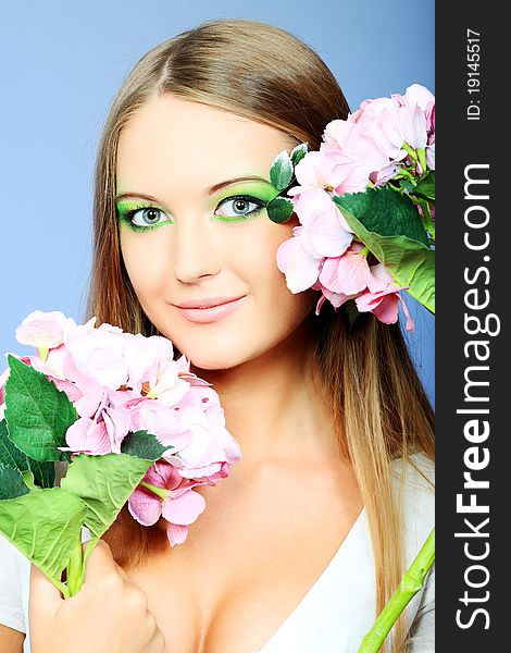 Portrait of a beautiful young woman with spring make-up. Beauty, fashion. Portrait of a beautiful young woman with spring make-up. Beauty, fashion.