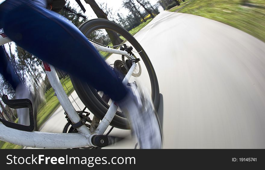 Bicycle riding in a city park on a lovely autumn/fall day (motion blur is used to convey movement)