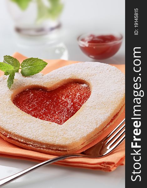 Heart shaped Linzer biscuit with jam filling. Heart shaped Linzer biscuit with jam filling