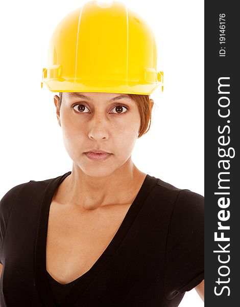 A close up of a woman in a yellow hard hat. A close up of a woman in a yellow hard hat.