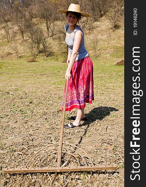 Young happy woman working in the garden. Young happy woman working in the garden