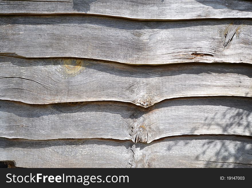 Rough wooden planks part of wall. Rough wooden planks part of wall