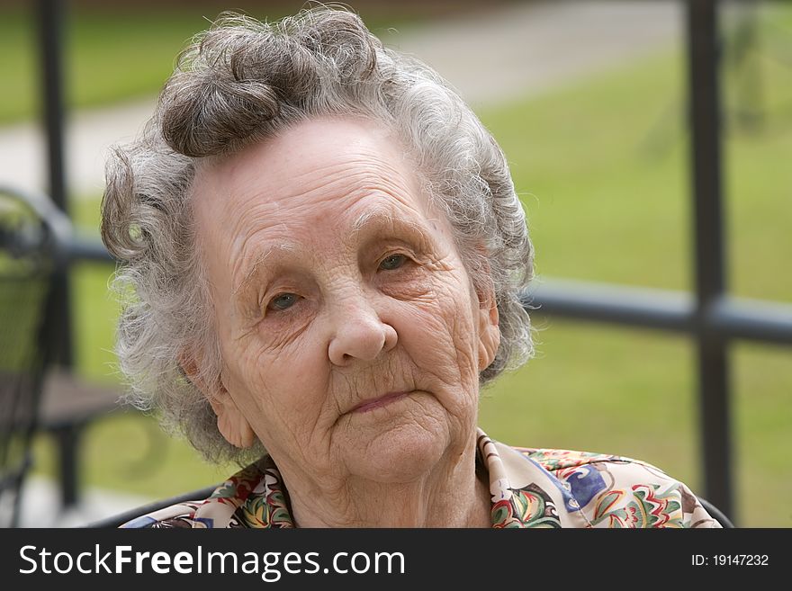 Portrait of elderly woman outside during day. Portrait of elderly woman outside during day