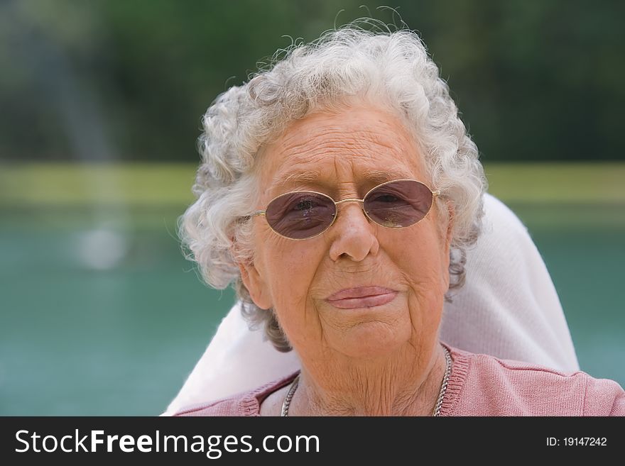 Portrait of elderly woman outside during the day. Portrait of elderly woman outside during the day