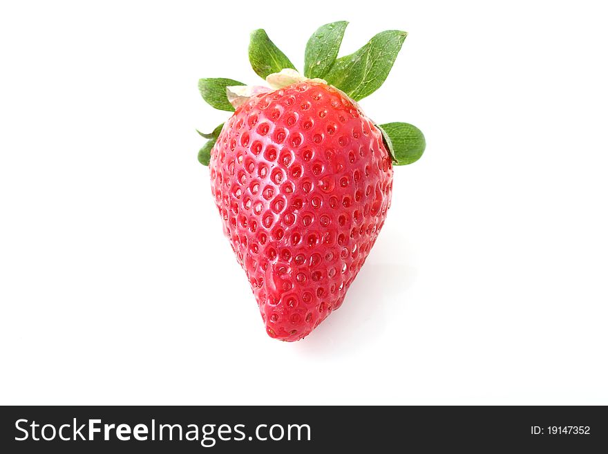 One ripe strawberry on a white background