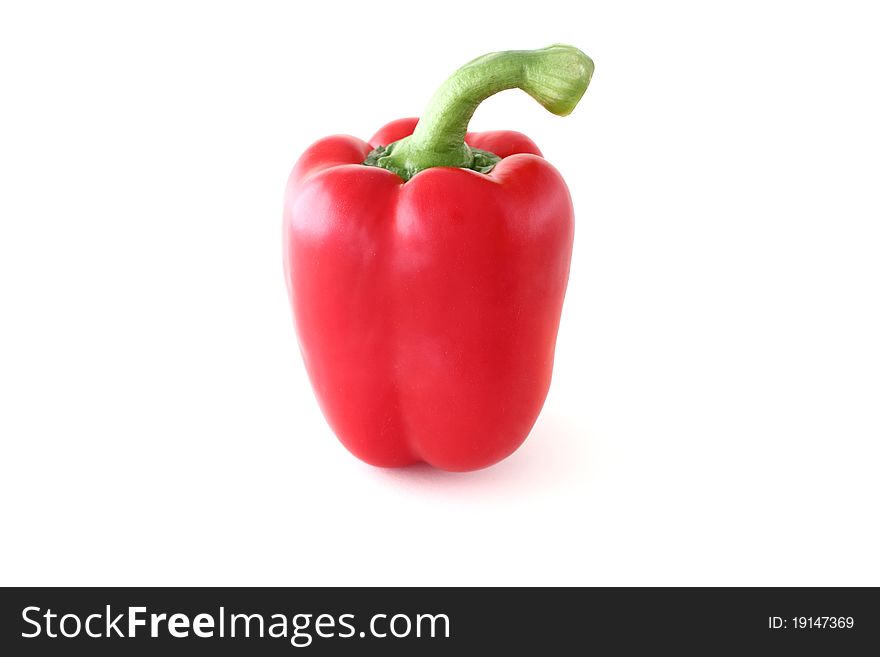 Red paprika with the green sprig on a white background. Red paprika with the green sprig on a white background
