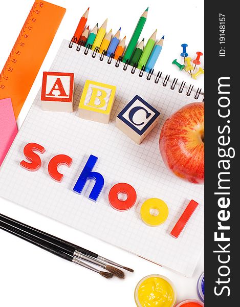Pencils and apple - concept school