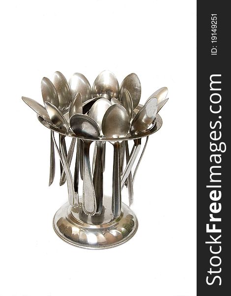 Stand holding stainless steel spoons neatly, isolate on white. Stand holding stainless steel spoons neatly, isolate on white