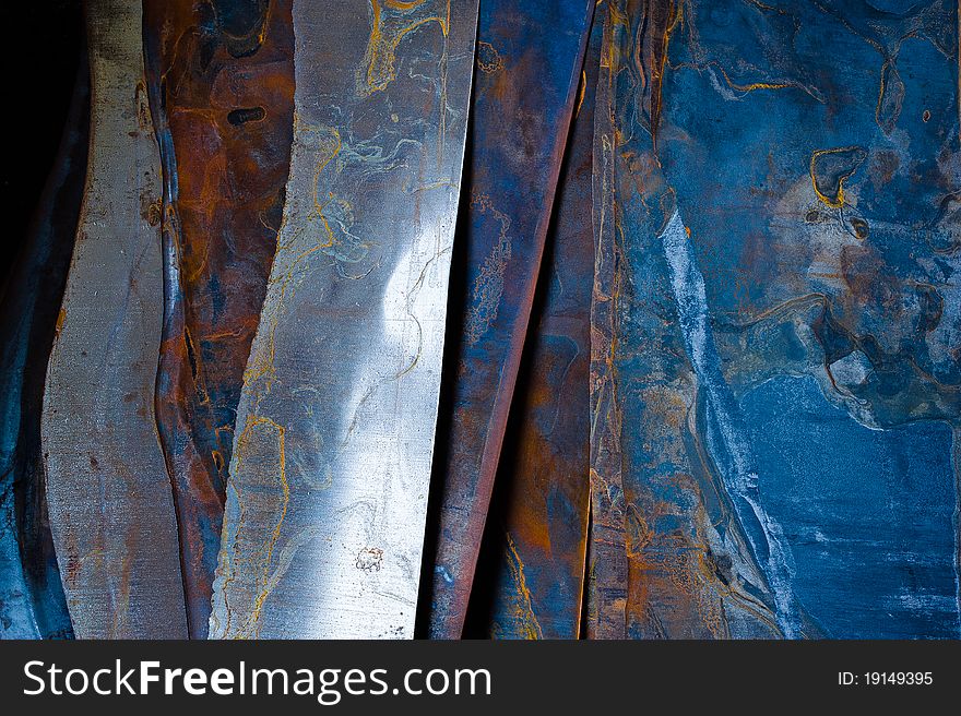 Rusted steel sheets and pieces in a workshop