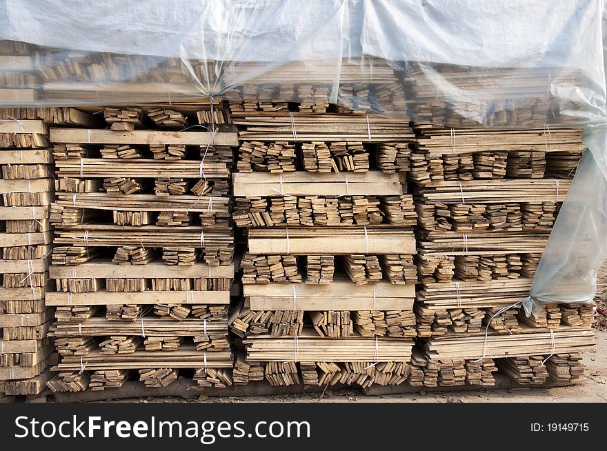 Stacking wood at timber market