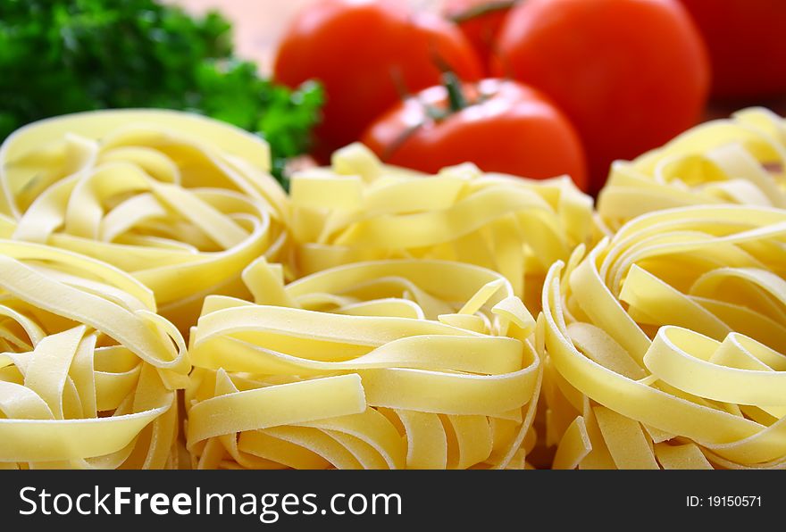 Italian pasta and fresh vegetables on the kitchen table.