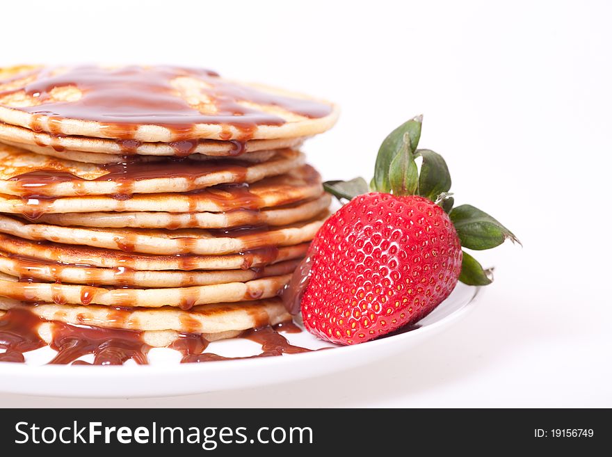 Pancakes stak topped with chocolate souce and strawbery. Pancakes stak topped with chocolate souce and strawbery.