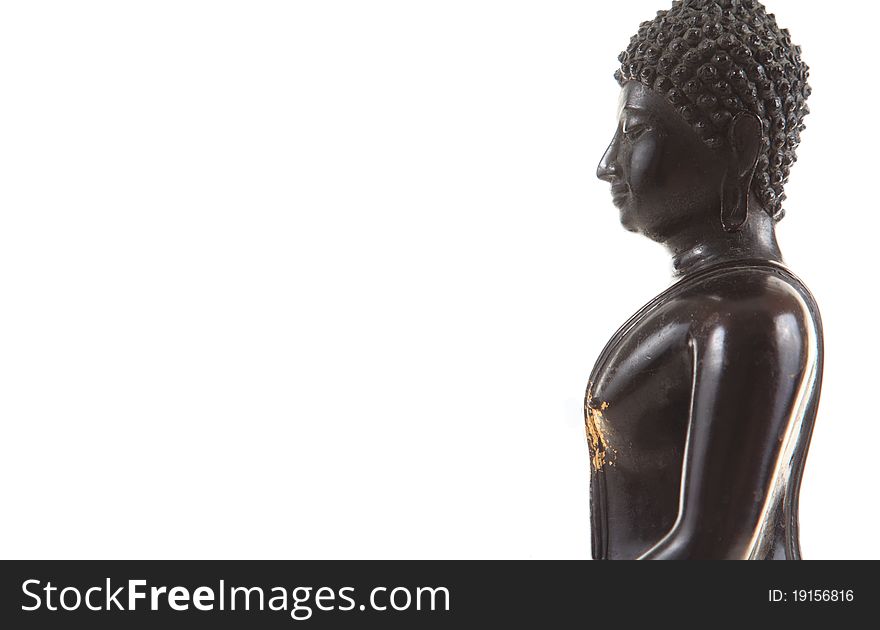 Ancient scratch black buddha isolated on white background