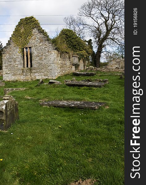 A vertical image of the old west kirk in culross scotland on a sunny spring morning. A vertical image of the old west kirk in culross scotland on a sunny spring morning