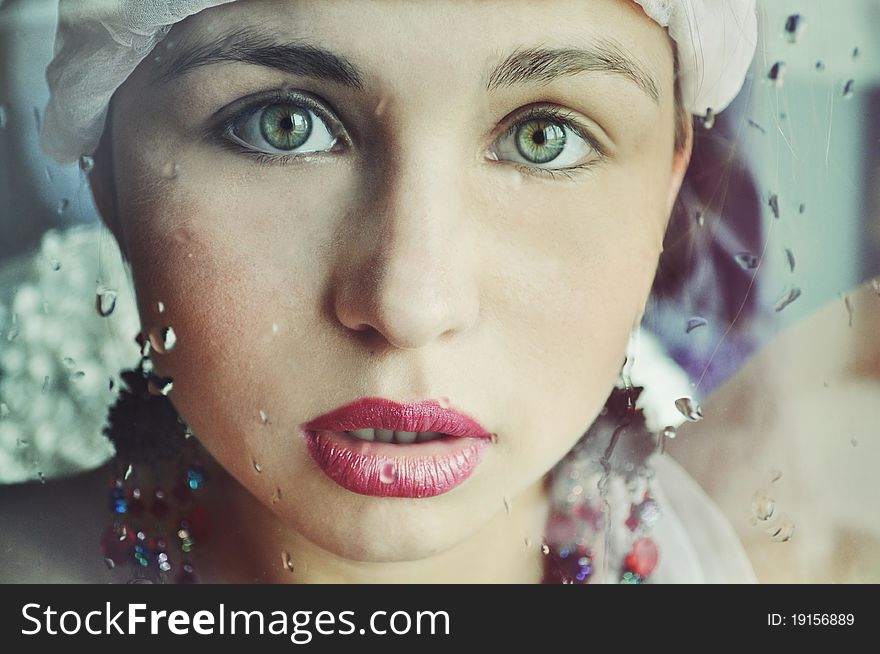 Young woman and a rain drops