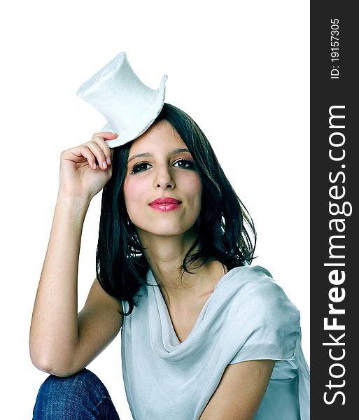 Portrait of a happy smiling young good looking girl with hat on white background