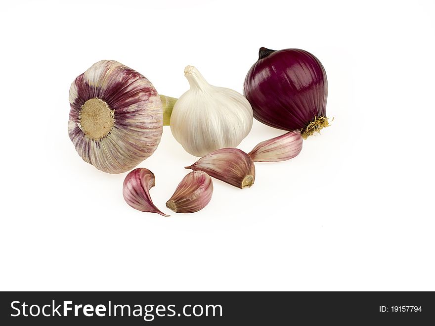 Vegetables onion and garlic placed over white background