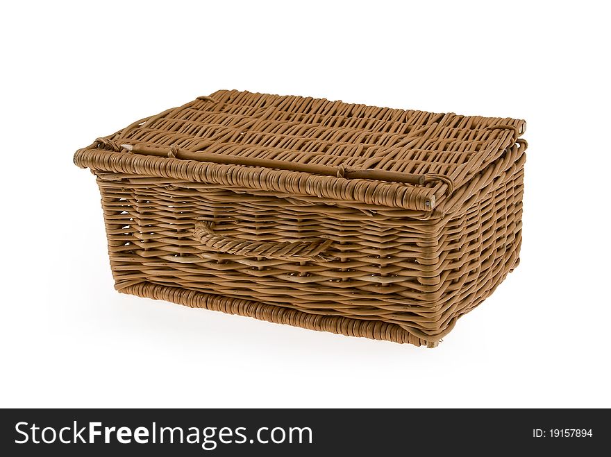 An empty wicker basket isolated on a white background.