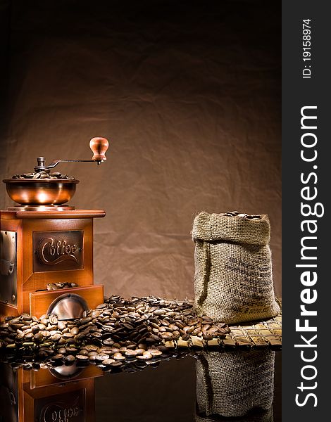 Mill and bag with coffee beans