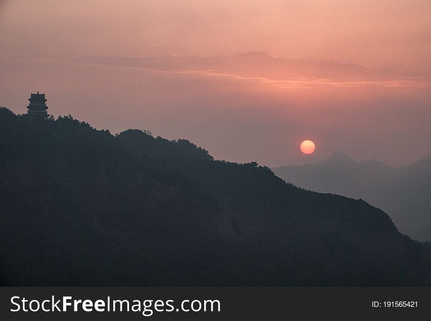 Sunrise in Xinglong County, Hebei Province, ChinaA house in the clouds is a fairyland