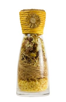 A Glass Bottle With Dried Herbs Royalty Free Stock Images