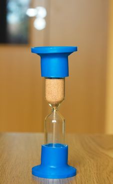 Hourglass On The Table Royalty Free Stock Photos
