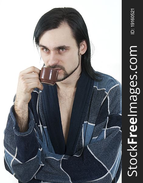 Sleepy man in housecoat with little cup of coffee. Sleepy man in housecoat with little cup of coffee