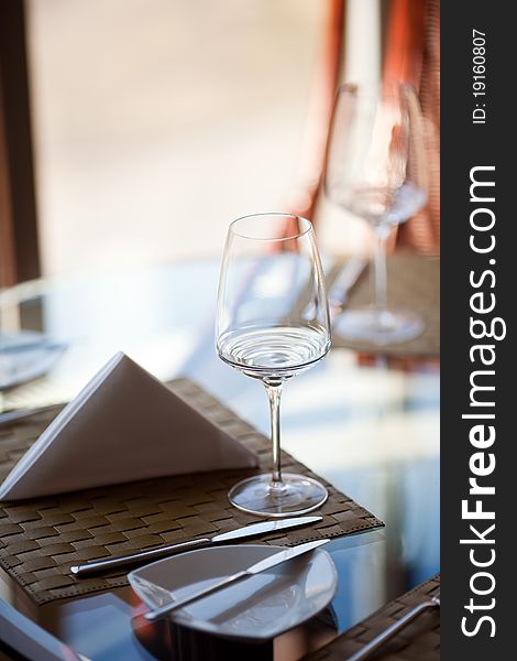 A wine glass on the table in a restaurant