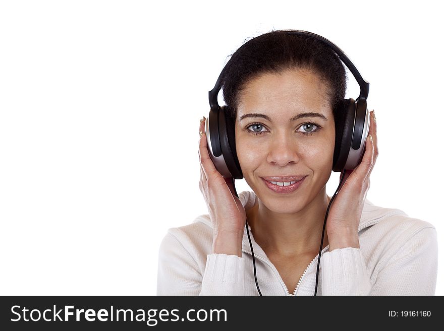 Beautiful, happy woman with headphones listens to mp3 music. Isolated on white background.