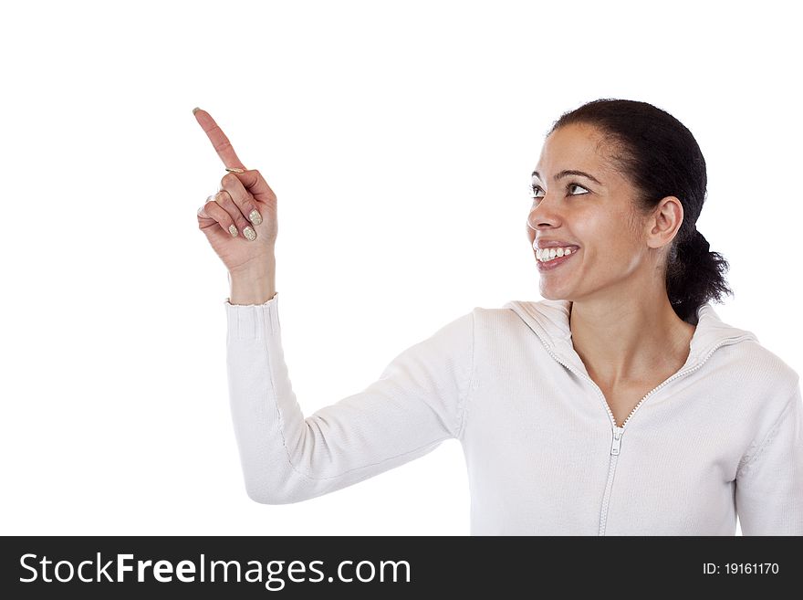 Beautiful, dark skinned woman pointing happy with finger at copyspace. Isolated on white background. Beautiful, dark skinned woman pointing happy with finger at copyspace. Isolated on white background.