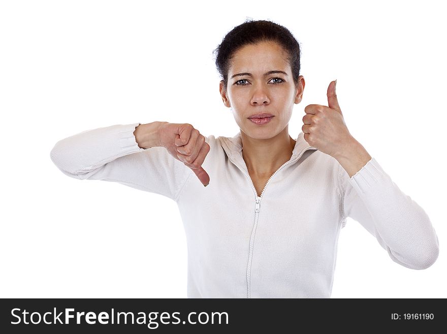 Woman is undecided and shows thumb up and down. Isolated on white background.