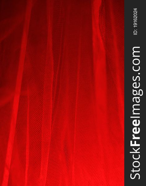 Red light is reflected through the gauze curtain. Red light is reflected through the gauze curtain