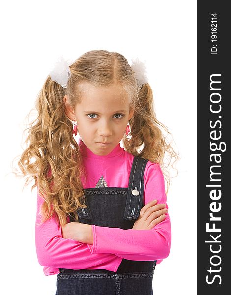 Young girl looking upset with her arms crossed