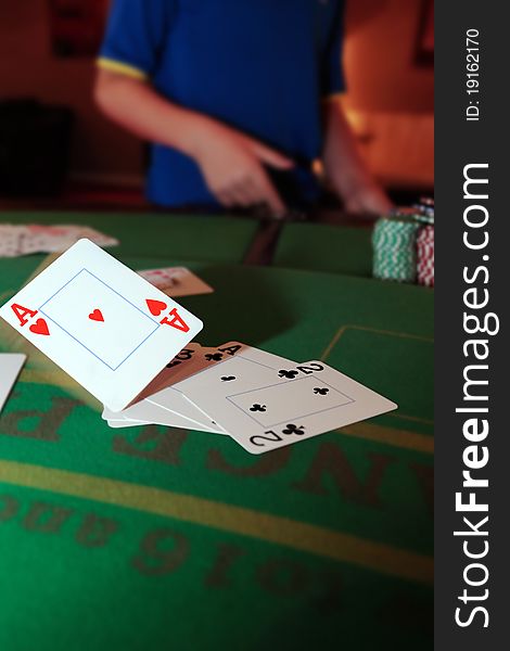 Poker player throwing in loosing cards