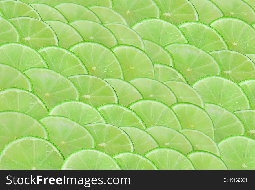 Limes slices forming scale background. Limes slices forming scale background