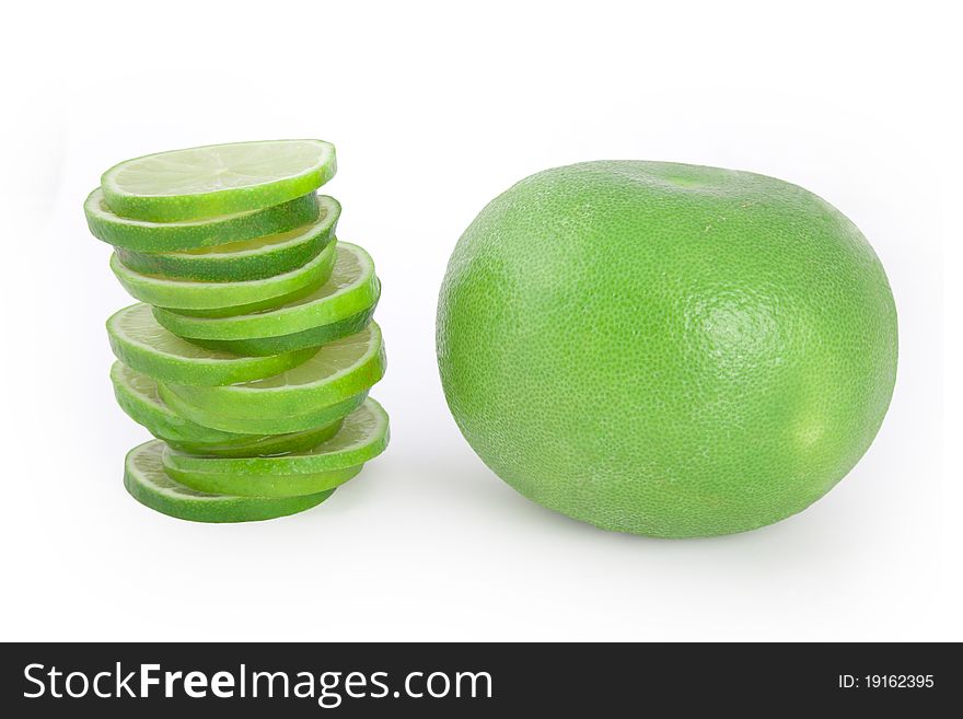 Heap of limes by green grapefruit isolated on white