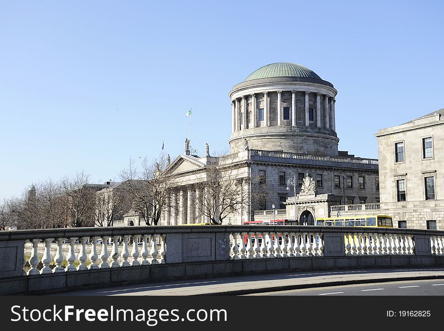 Four Courts on the River Liffey in Dublin, Ireland. One of Dublin's finest buildings, the Four Courts, captured on a beautiful spring day.