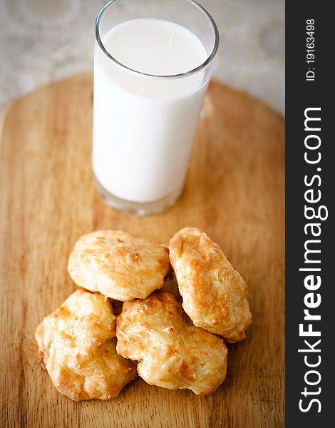 Tasty cheese buns with a glass of milk