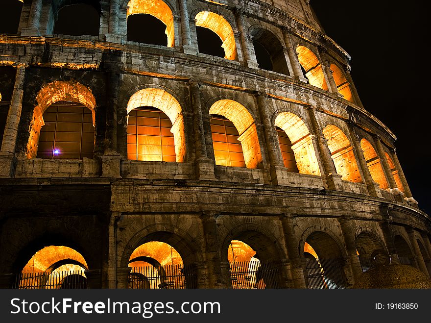 Roman Coliseum by night with Illuminated arches, Rome Italy