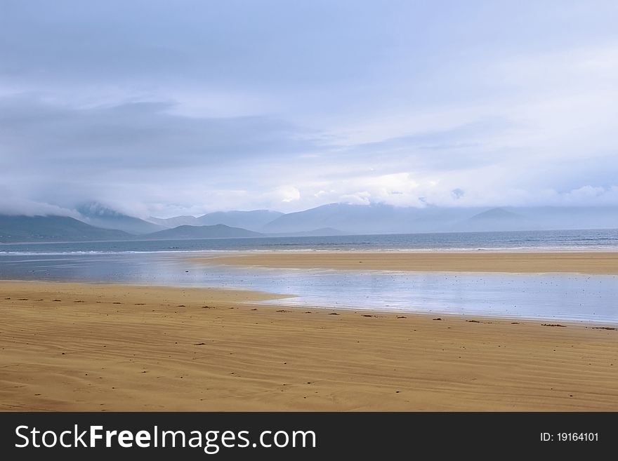 Golden beach with blue sky and clouds on the Dingle Peninsula Ireland. Golden beach with blue sky and clouds on the Dingle Peninsula Ireland