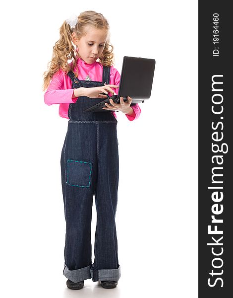 Young girl typing something on her own laptop. Young girl typing something on her own laptop